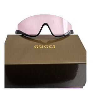 Gucci GG1650S 002 shield mask sunglass with a shiny black frame
